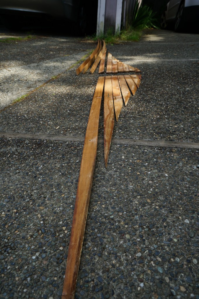 K tries to organize all of the planks correctly.